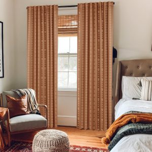 Terracotta-colored tufted mesh textured curtains