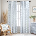 White curtains with polka dot stripe print.